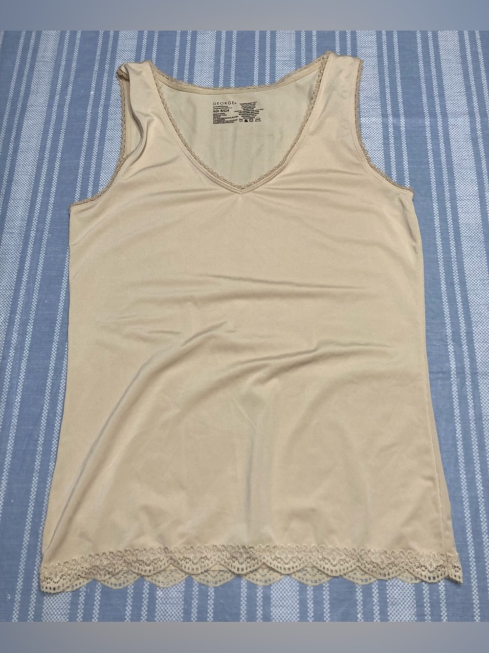 George gold colored tank top.